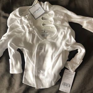 White onesie shirt with baby mitten.